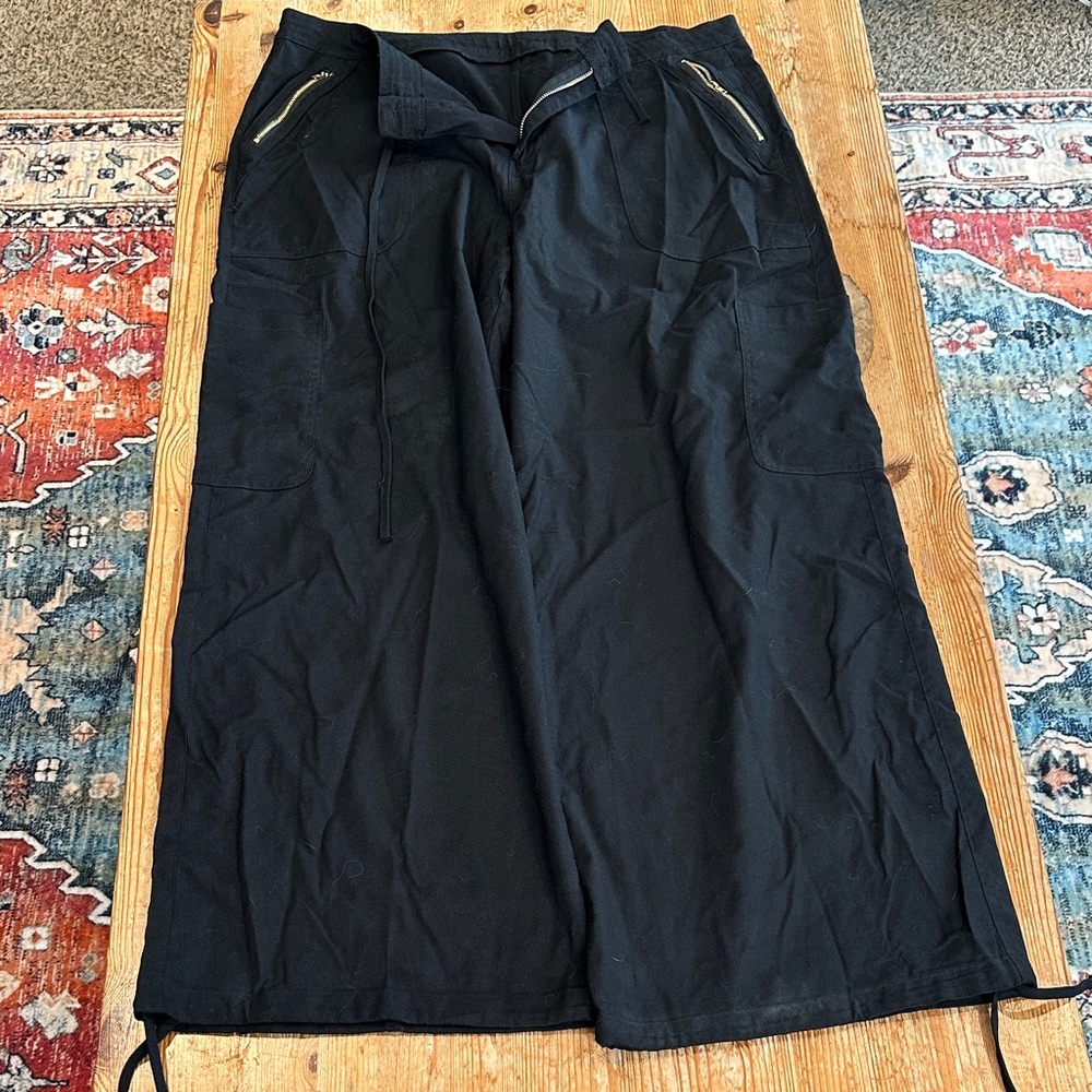 Black Wide-Leg Pants with Zipper Pockets; drawstring ankles and waist.